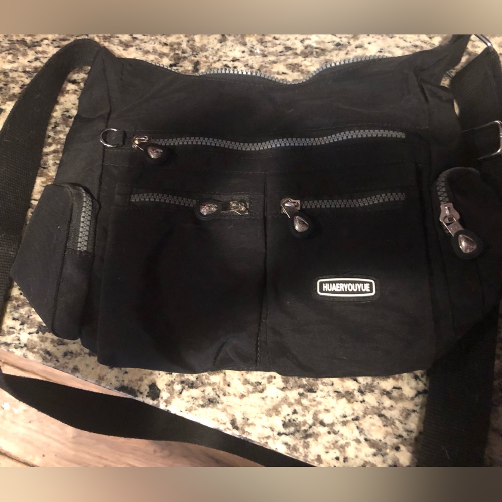 Huaeryouyue Casual Crossbody Black Canvas Bag
Clean inside never used